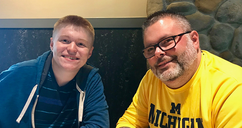 Director of operations smiling with family